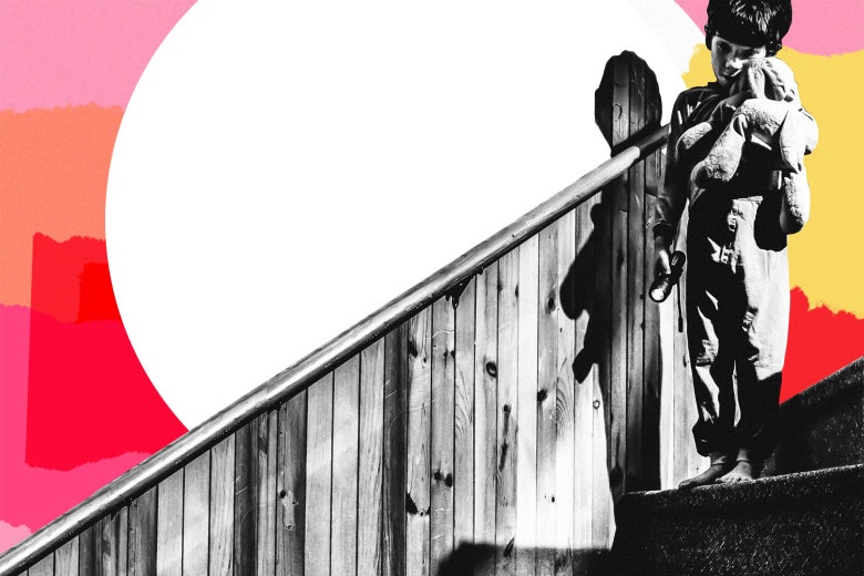 A boy holding a stuffed animal, looking fearfully down the stairs.